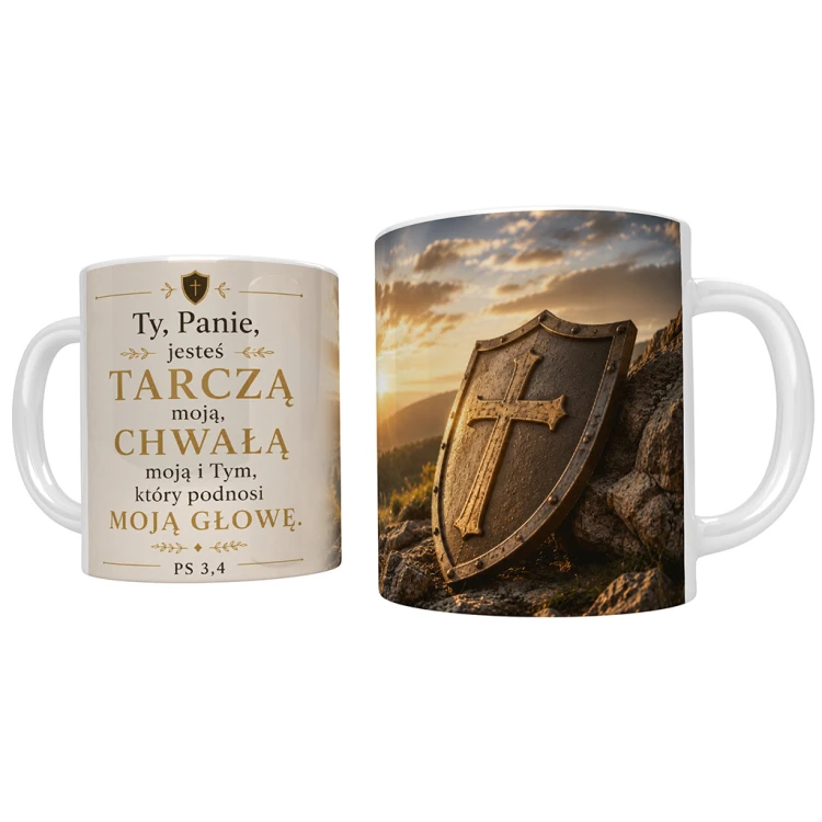 Kubek chrześcijański z cytatem z Psalmu 3 „Ty, Panie, jesteś tarczą moją, chwałą moją i Tym, który podnosi moją głowę” (Ps 3,4) oraz grafiką tarczy z krzyżem opartej o skałę.
