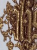 Złoty haft IHS i dekoracyjne obrzeże welonu ecru – zbliżenie