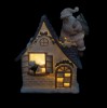 Domek świąteczny z Mikołajem LED Favola 18 cm - włączone podświetlenie LED