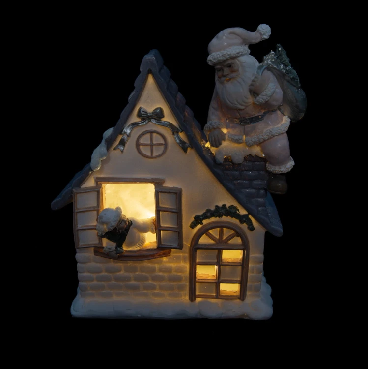 Domek świąteczny z Mikołajem LED Favola 18 cm - włączone podświetlenie LED