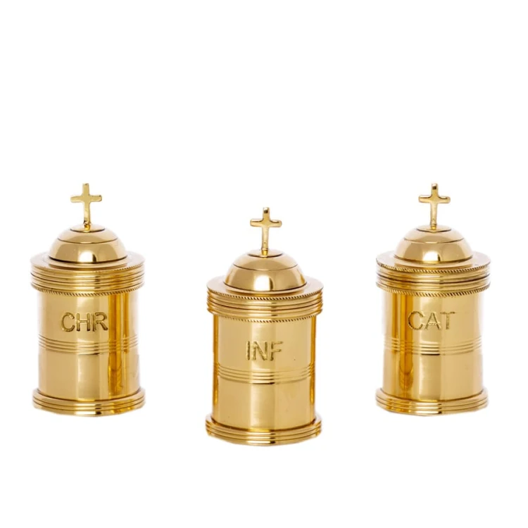 Zestaw mosiężnych pojemników na oleje