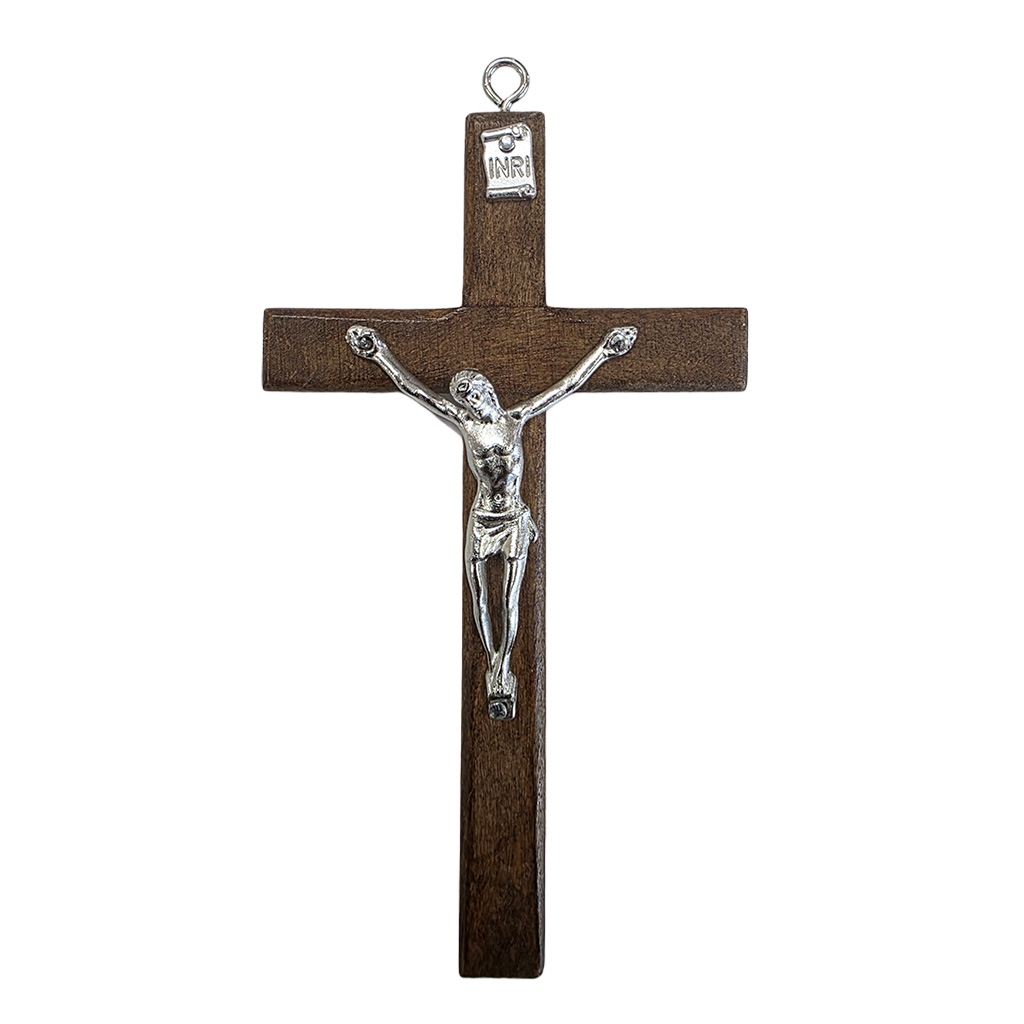 Traditional wooden wall cross 12 cm high in a dark walnut wood finish with a silver metal corpus of Jesus and a hanging loop at the top.