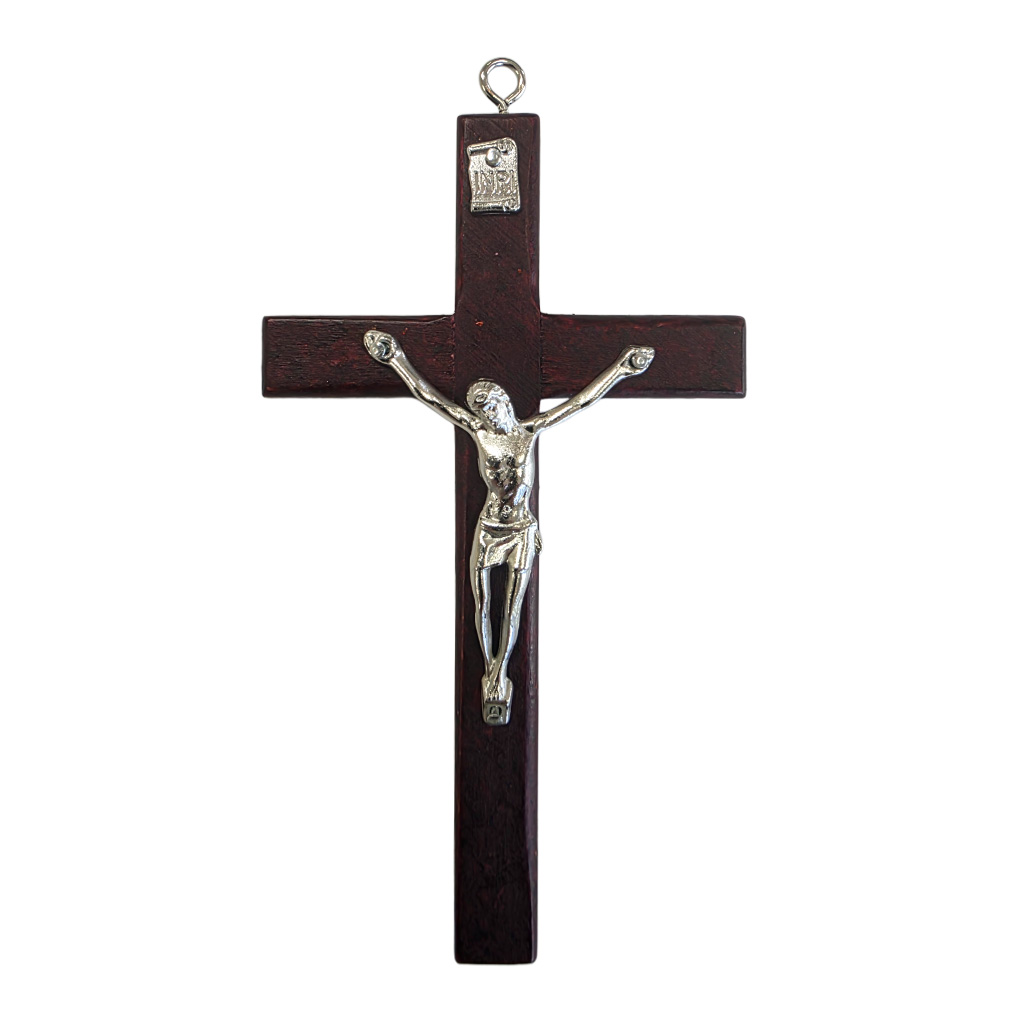 Modern and elegant wall cross 12 cm high made of deep cherry finish wood, decorated with a silver metal corpus of Jesus and a hanging loop.